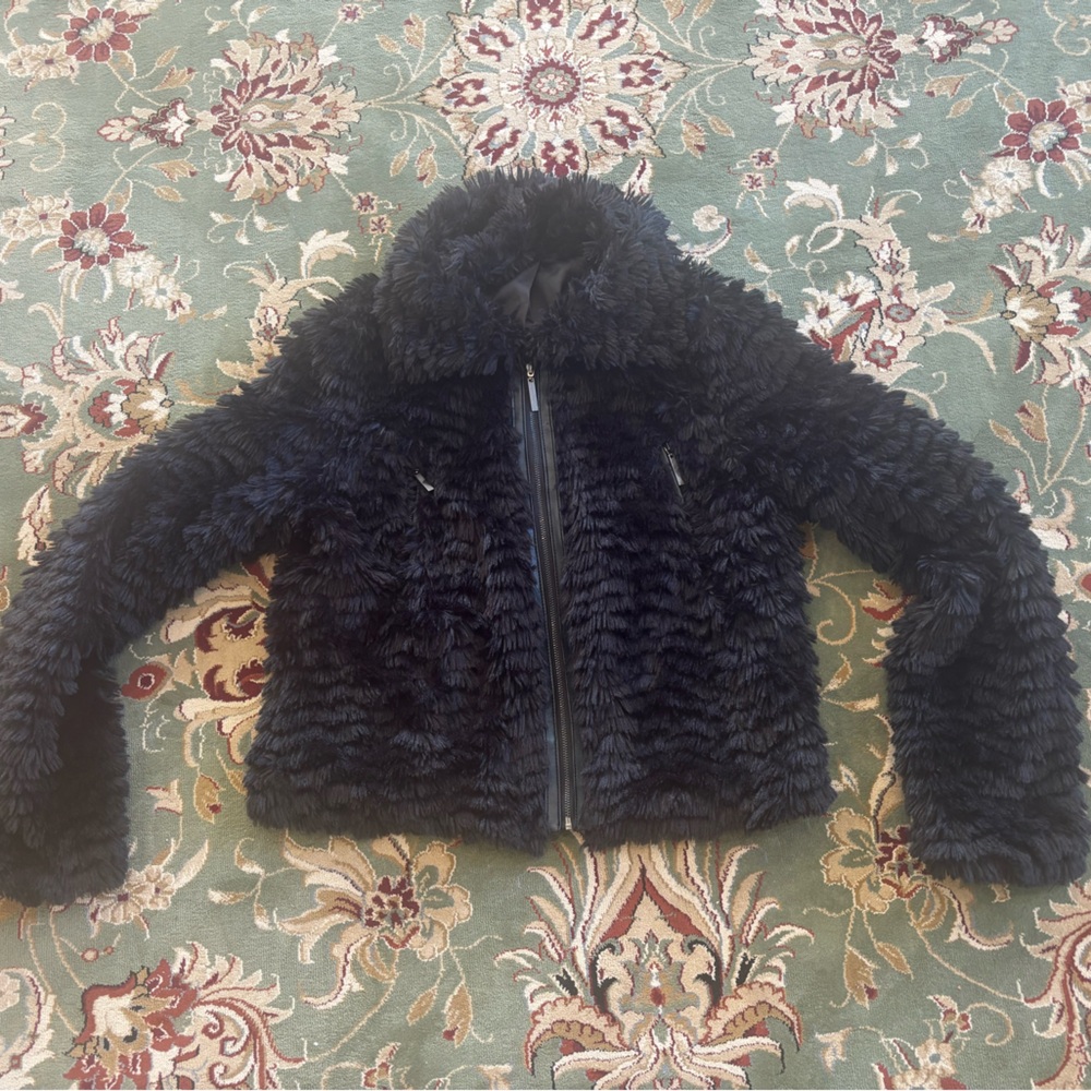 Faux fur jacket with leather trimming zipper detail and pockets